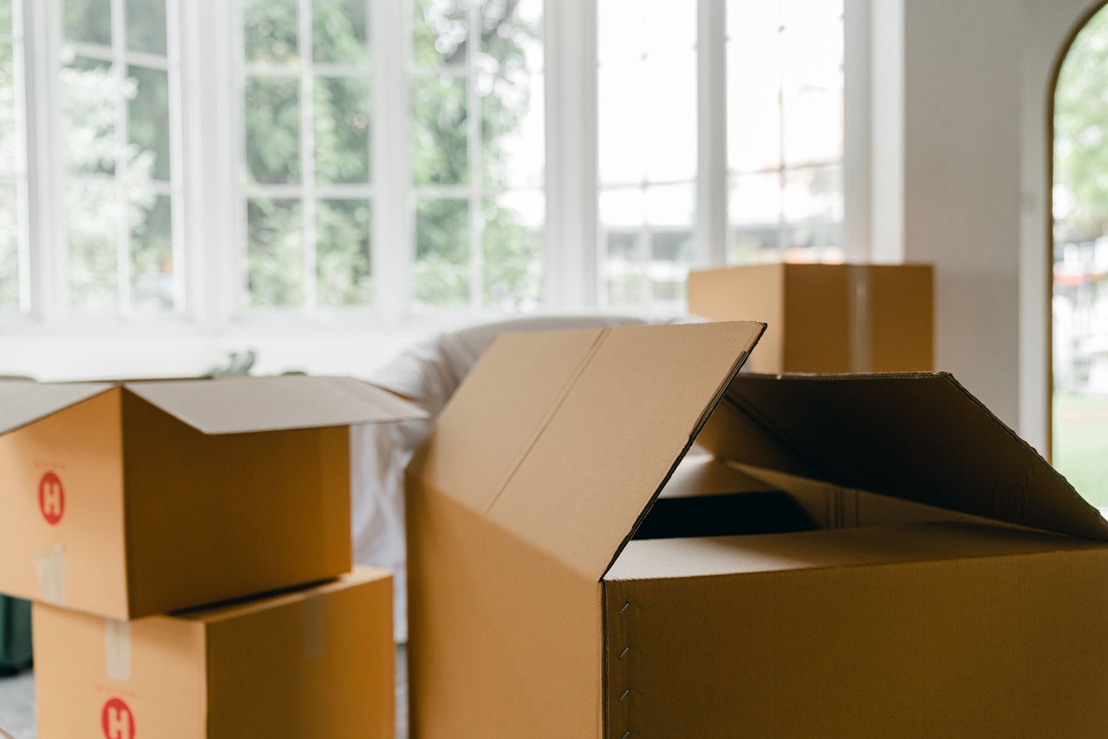 Moving boxes in a bright empty home